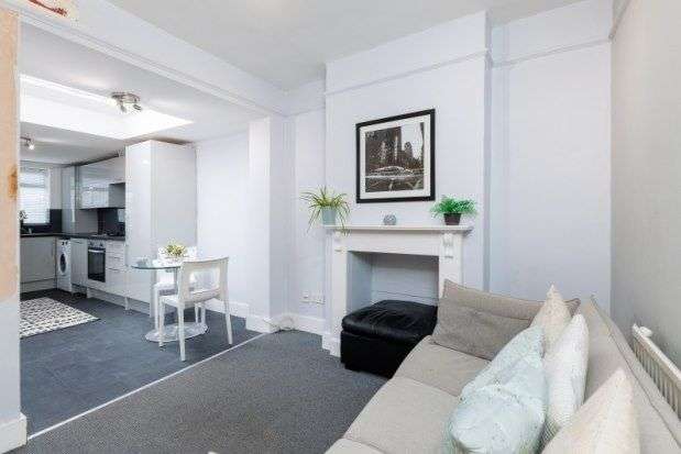 Terraced house to rent in Hartfield Crescent, London SW19